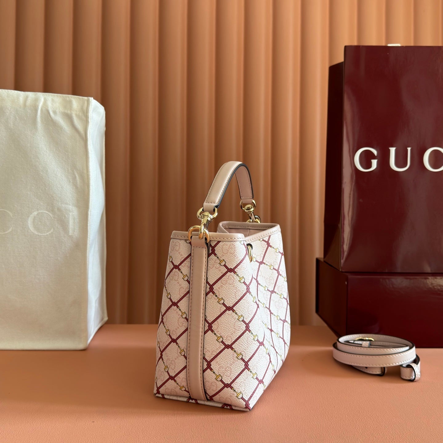 GUCCI 26S GG EMBLEM BUCKET BAG 19 IN LIGHT PINK COATED FABRIC