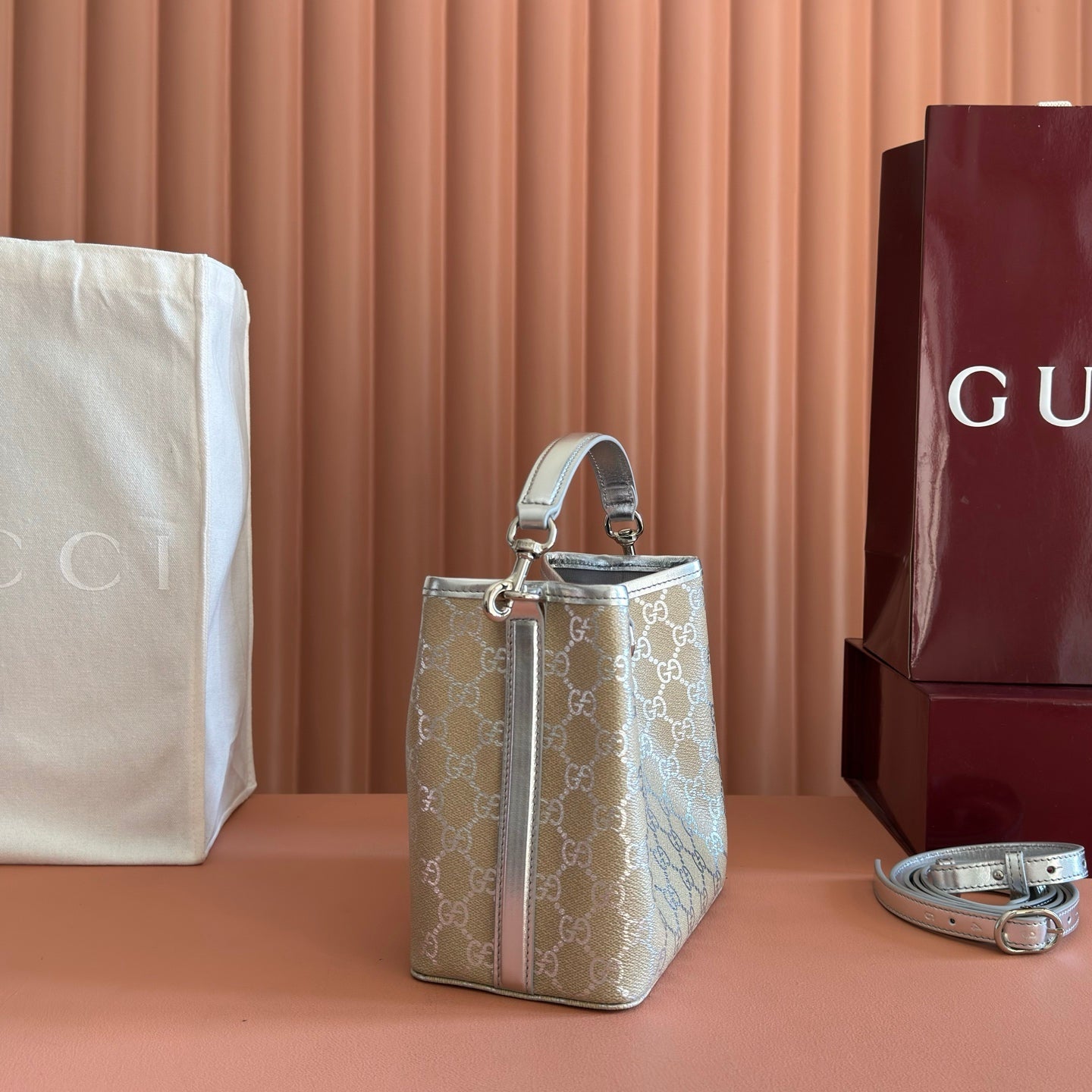 GUCCI 26S GG EMBLEM BUCKET BAG 19 IN BEIGE AND SILVER CANVAS
