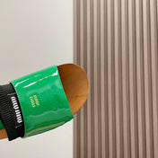 SLIPPERS IN GREEN GLOSSY CALFSKIN WITH BLACK HALF-FOOT SOCKS