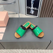 SLIPPERS IN GREEN GLOSSY CALFSKIN WITH BLACK HALF-FOOT SOCKS