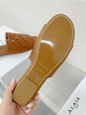 ALAIA VIENNE FLAT MULES IN CHOCOLATE BROWN LAMBSKIN