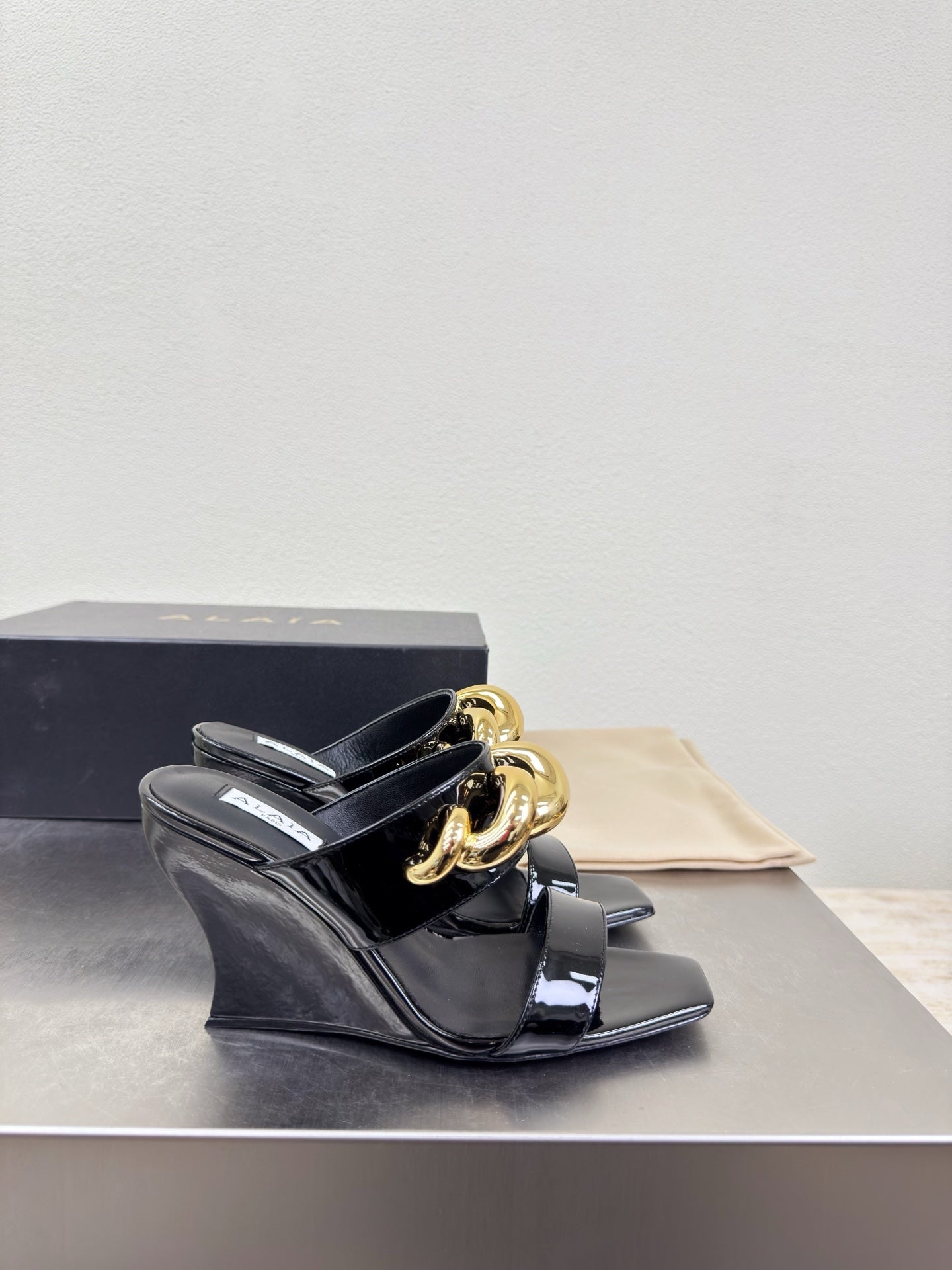 ALAIA 26S DOUBLE STRAP WEDGE SANDALS 110 MM IN BLACK GLOSSY CALFSKIN WITH GOLD HARDWARE