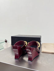 ALAIA 26S DOUBLE STRAP WEDGE SANDALS 110 MM IN DARK RED GLOSSY CALFSKIN WITH GOLD HARDWARE