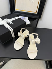 FLAT SANDALS IN WHITE CALFSKIN WITH BOW