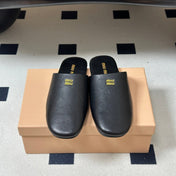 MIUMIU 26S MULE LOAFERS IN BLACK CALSKIN
