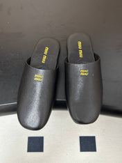 MIUMIU 26S MULE LOAFERS IN BLACK CALSKIN