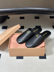 MIUMIU 26S MULE LOAFERS IN BLACK CALSKIN
