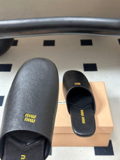 MIUMIU 26S MULE LOAFERS IN BLACK CALSKIN