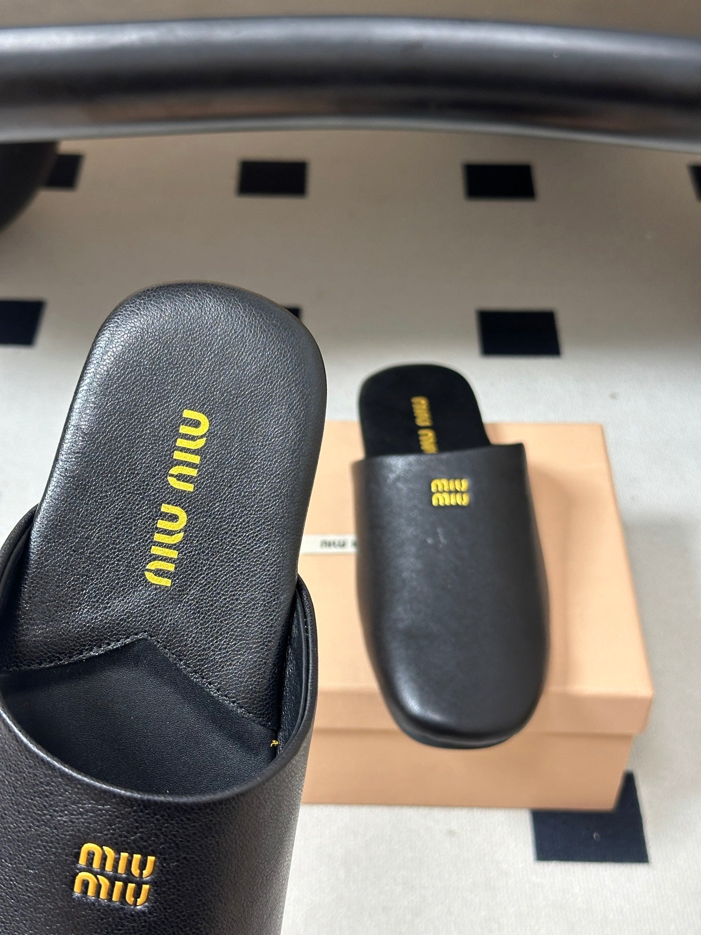 MIUMIU 26S MULE LOAFERS IN BLACK CALSKIN