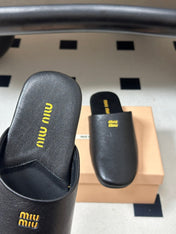 MIUMIU 26S MULE LOAFERS IN BLACK CALSKIN