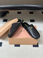 MIUMIU 26S MULE LOAFERS IN BLACK CALSKIN
