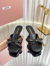 MIUMIU 26S MULE SANDALS 55MM IN LEOPARD PRINT CALF HAIR WITH BOW