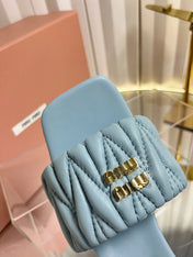 MIUMIU 26S PADDED MATELASSE MULE HEELS 65MM IN LIGHT BLUE CALFSKIN GOLD HARDWARE