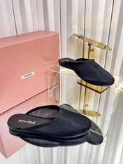 MIUMIU 26S FLAT MULES IN BLACK FABRIC AND LEATHER 