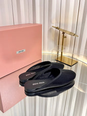 MIUMIU 26S FLAT MULES IN BLACK FABRIC AND LEATHER 