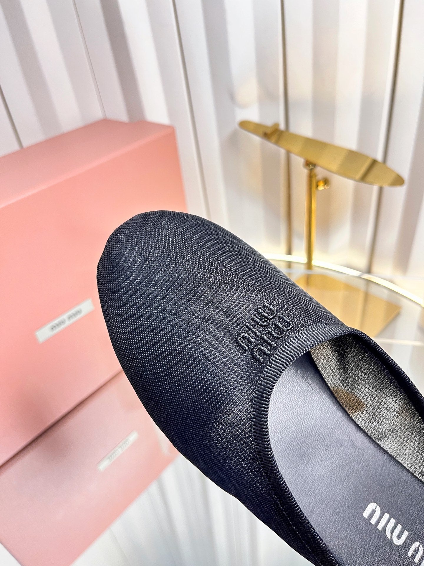 MIUMIU 26S FLAT MULES IN BLACK FABRIC AND LEATHER 