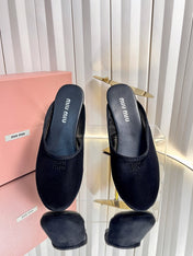 MIUMIU 26S FLAT MULES IN BLACK FABRIC AND LEATHER 