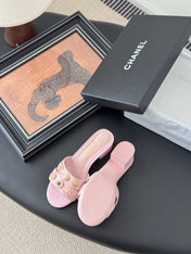 MULE SLIDE SANDALS IN PINK LAMBSKIN WITH LOGO STICKER DETAIL