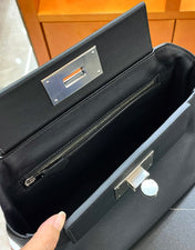 MINI 24/24 21CM IN BLACK EVERCOLOR CALFSKIN SILVER KELLY BUCKLE