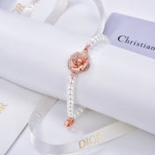 CD 26S PEARL FLOWER CHARM BRACELET IN ROSE GOLD TONE METAL 631860