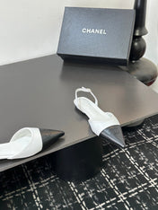 CHANEL 26S POINTED-TOE SLINGBACKS IN WHITE AND BLACK LAMBSKIN
