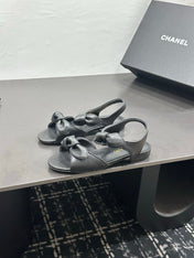 CHANEL 26S BOW SANDALS IN BLACK CALFSKIN