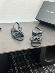 CHANEL 26S BOW SANDALS IN BLACK CALFSKIN