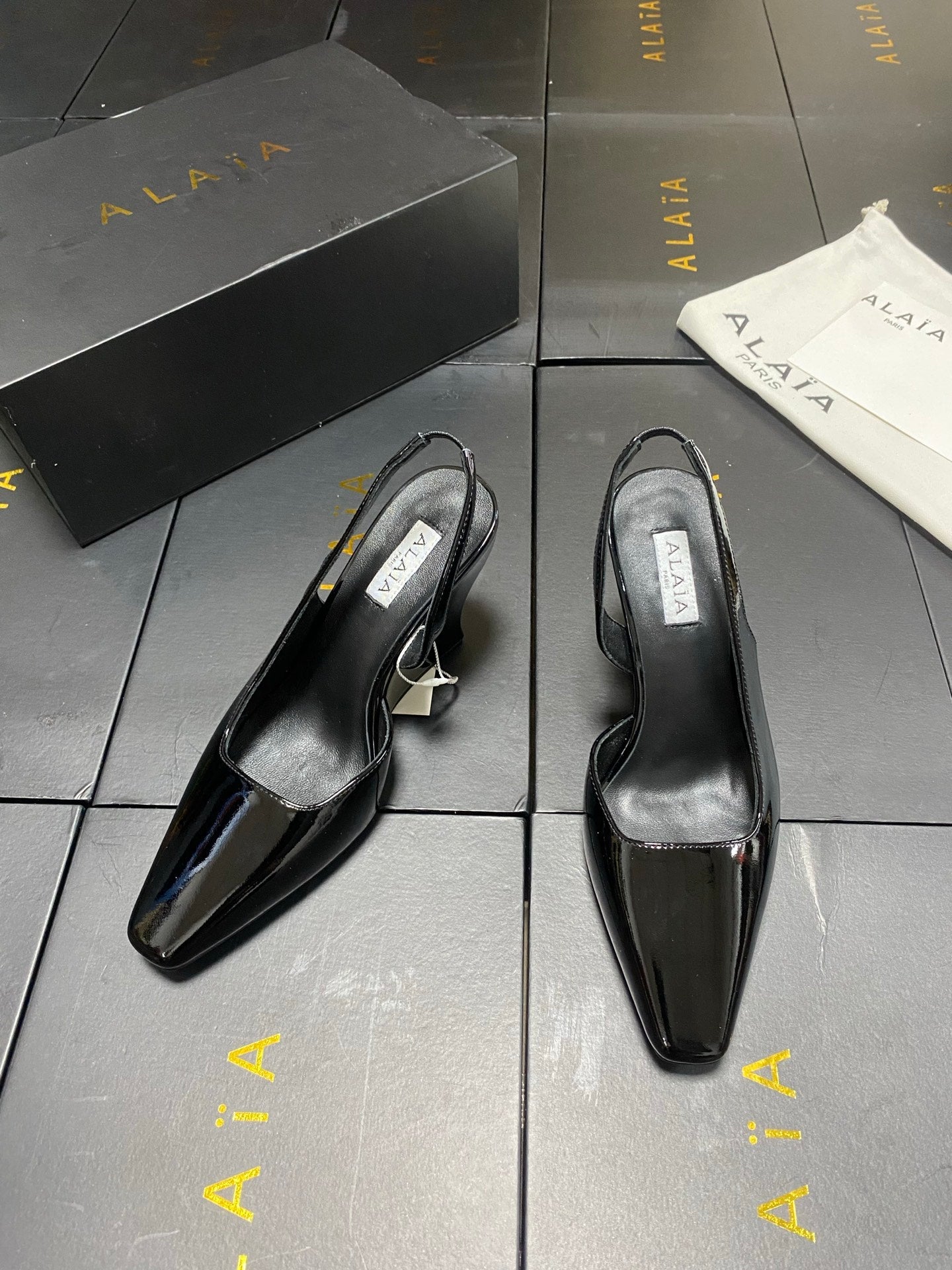 ALAIA 26S WEDGE SLINGBACKS 95 MM IN BLACK PATENT CALFSKIN
