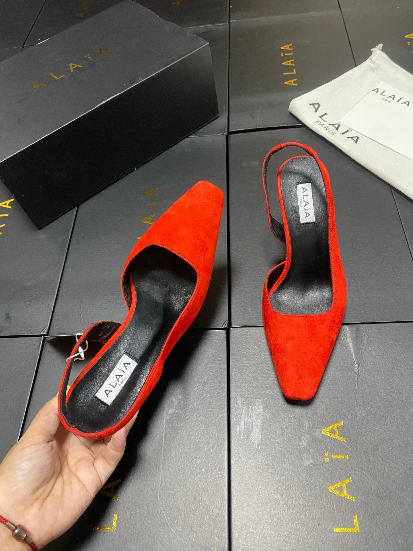ALAIA 26S WEDGE SLINGBACKS 95 MM IN ORANGE RED SUEDE