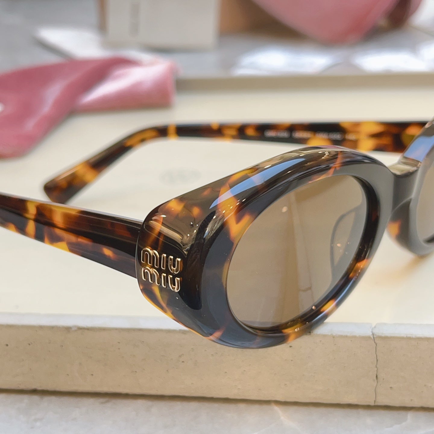 MIUMIU 26S OVAL FRAME IN ACETATE 415247