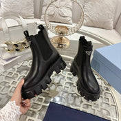 PRADA 26S MONOLITH CHELSEA BOOTS IN BLACK SHINY CALFSKIN AND FABRIC