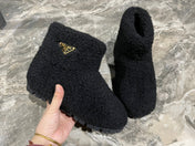 PRADA 26S ANKLE BOOTS IN BLACK FUR