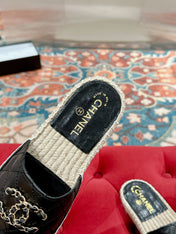 FLAT SLIPPERS IN BLACK LAMBSKIN AND WOVEN WITH LOGO
