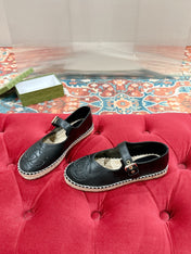 GG CROSS STRAP FLAT SHOES IN BLACK CALFSKIN WITH STRAW SOLE