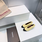 CHANEL 26S COLOR-BLOCK HIGH HEELS 45 MM IN YELLOW AND BLACK LAMBSKIN