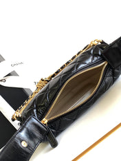 CC 16 MINI POUCH IN BLACK GRAINED CALFSKIN AND GOLD METAL