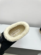 MIUMIU 26S ANKLE SHEARLING BOOTS IN BLACK SUEDE