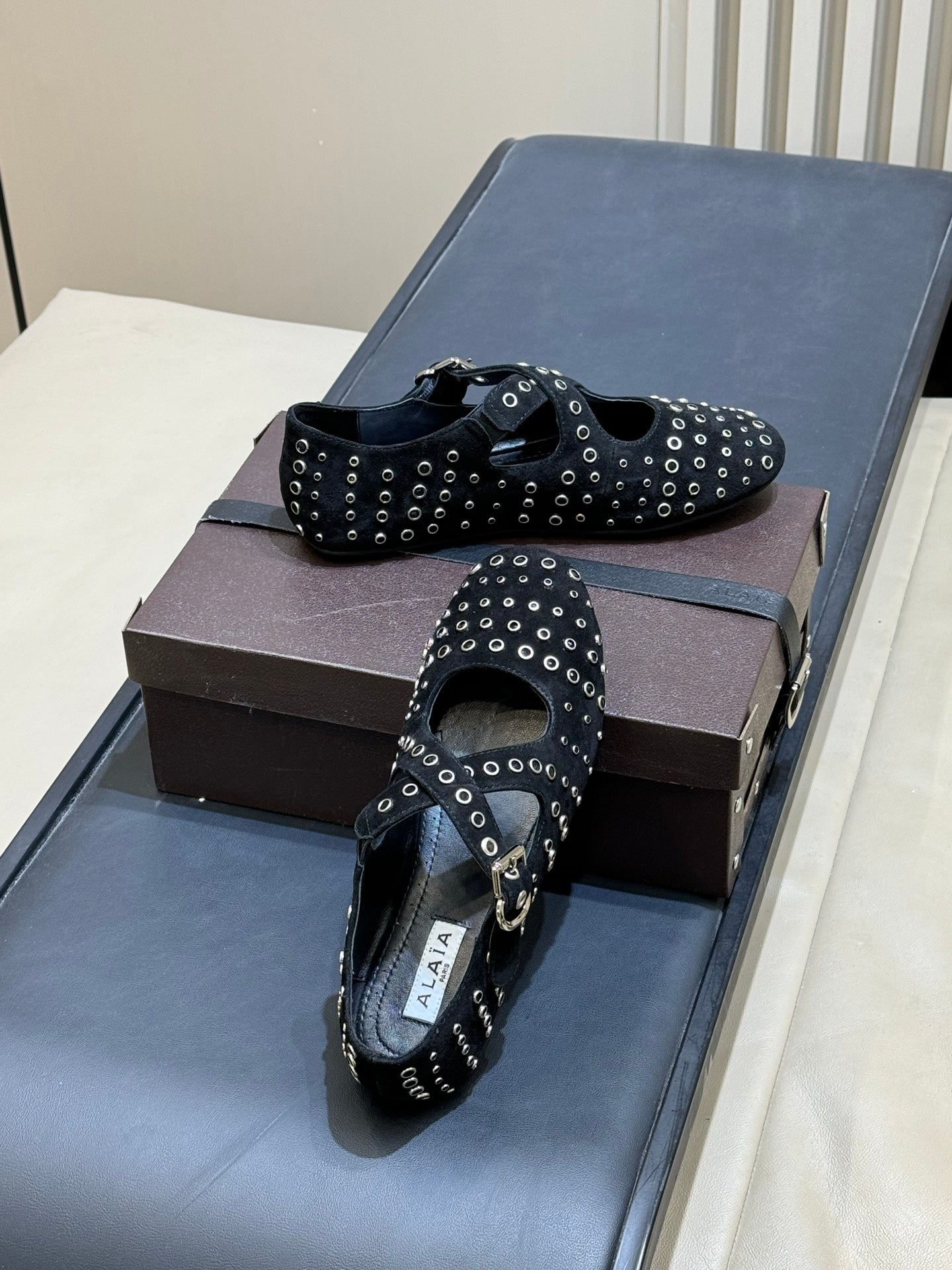 ALAIA 26S CROSS-STRAP FLATS IN BLACK SUEDE WITH SILVER HARDWARE