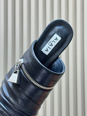 ALAIA 26S PLEATED MULES IN BLACK LAMBSKIN