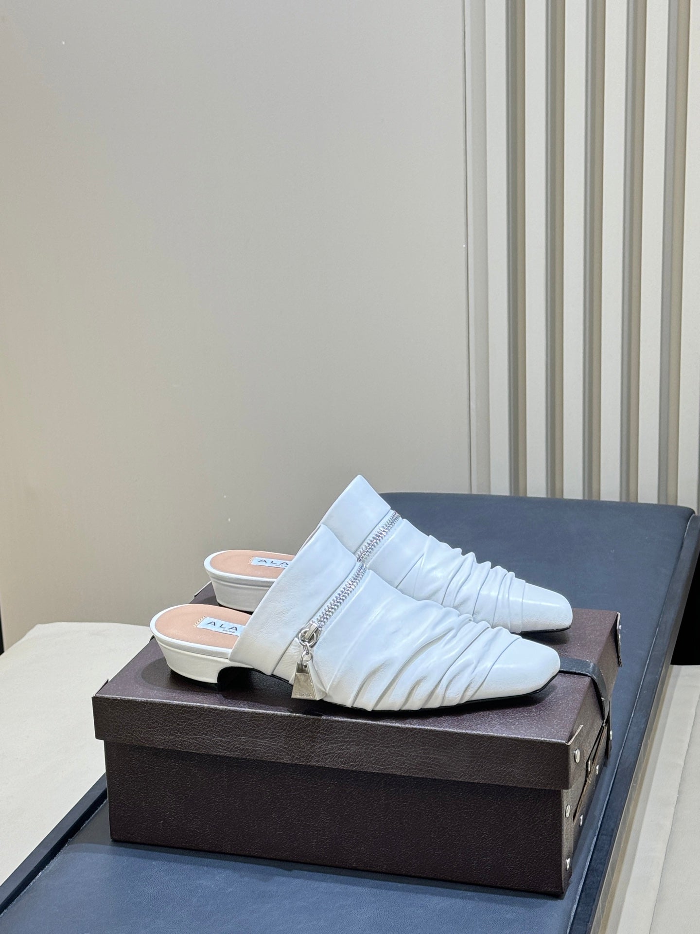 ALAIA 26S PLEATED MULES IN WHITE LAMBSKIN