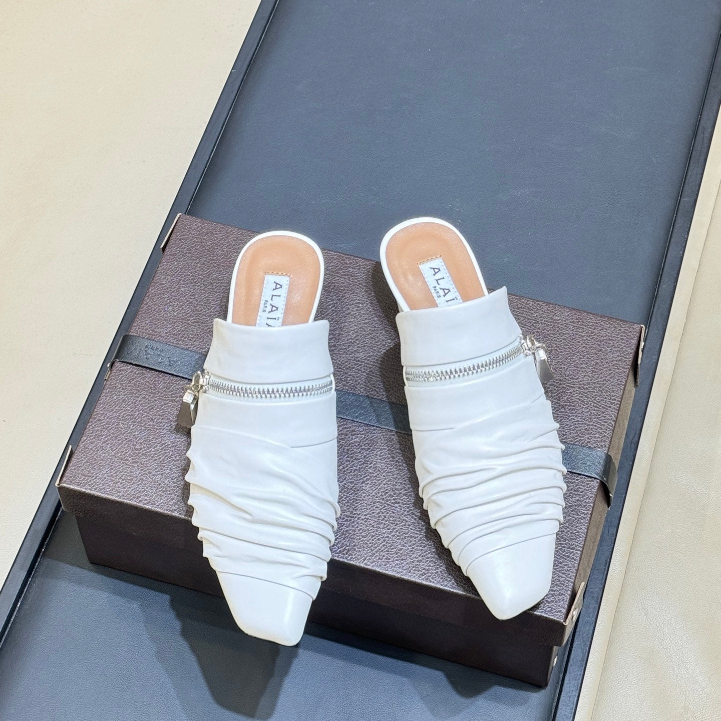 ALAIA 26S PLEATED MULES IN WHITE LAMBSKIN