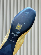 ALAIA 26S BALLET FLATS IN GOLD LAMBSKIN