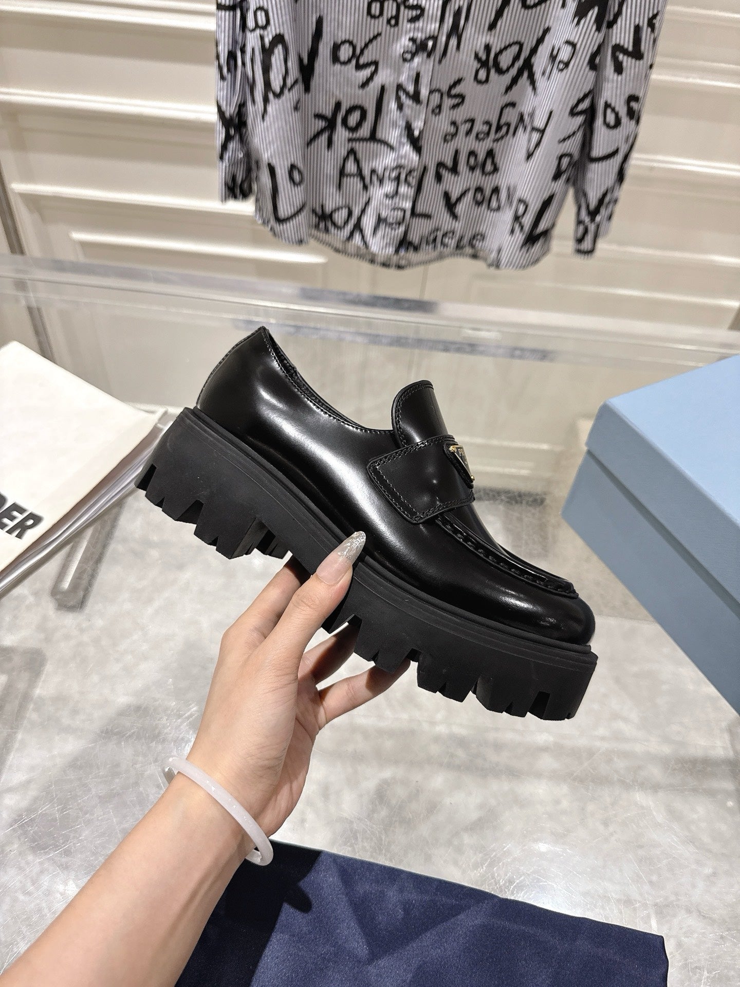 PRADA 26S PLATFORM LOAFERS 45MM IN BLACK SHINE CALFSKIN