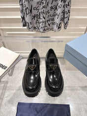 PRADA 26S PLATFORM LOAFERS 45MM IN BLACK SHINE CALFSKIN