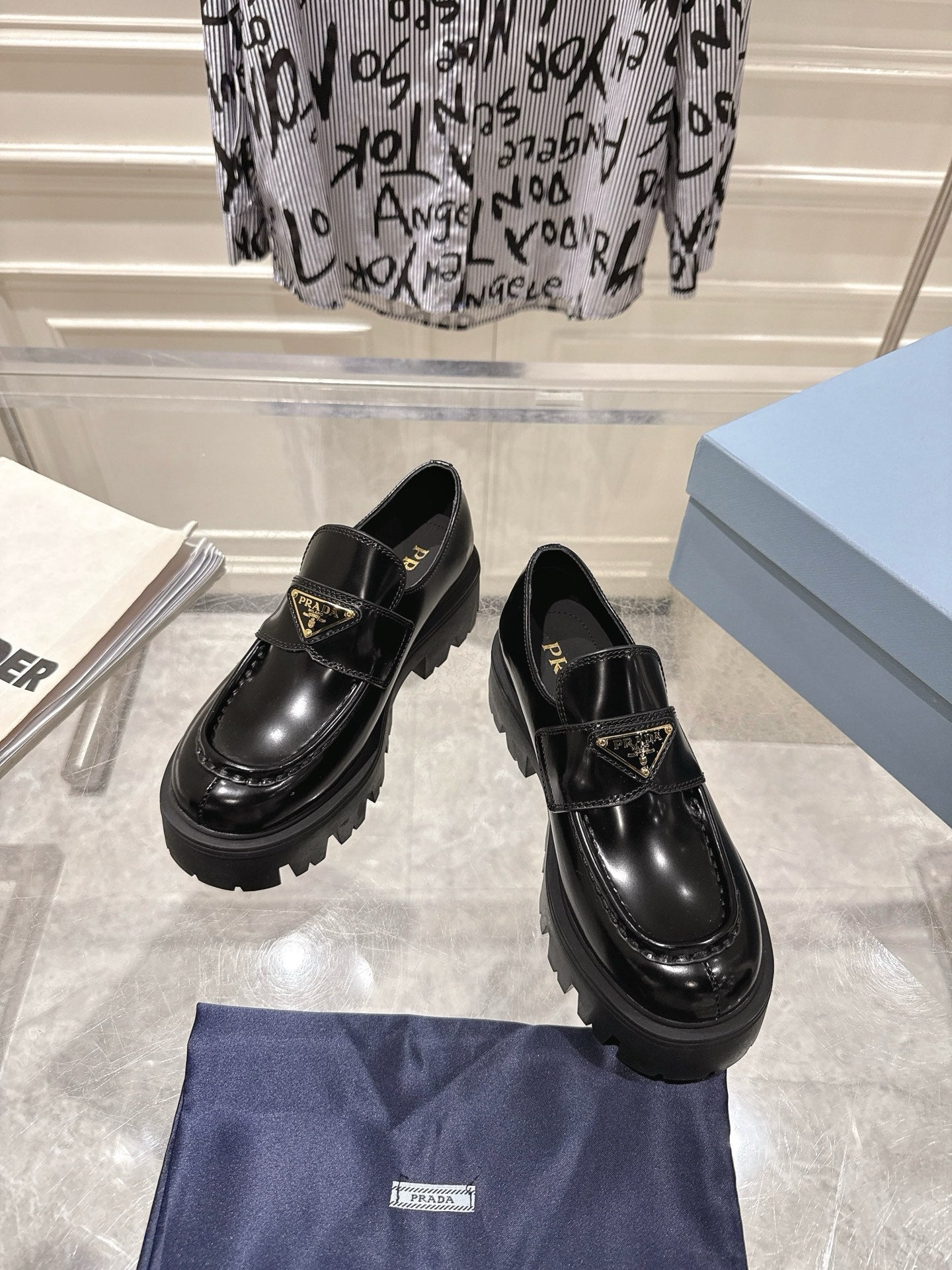 PRADA 26S PLATFORM LOAFERS 45MM IN BLACK SHINE CALFSKIN