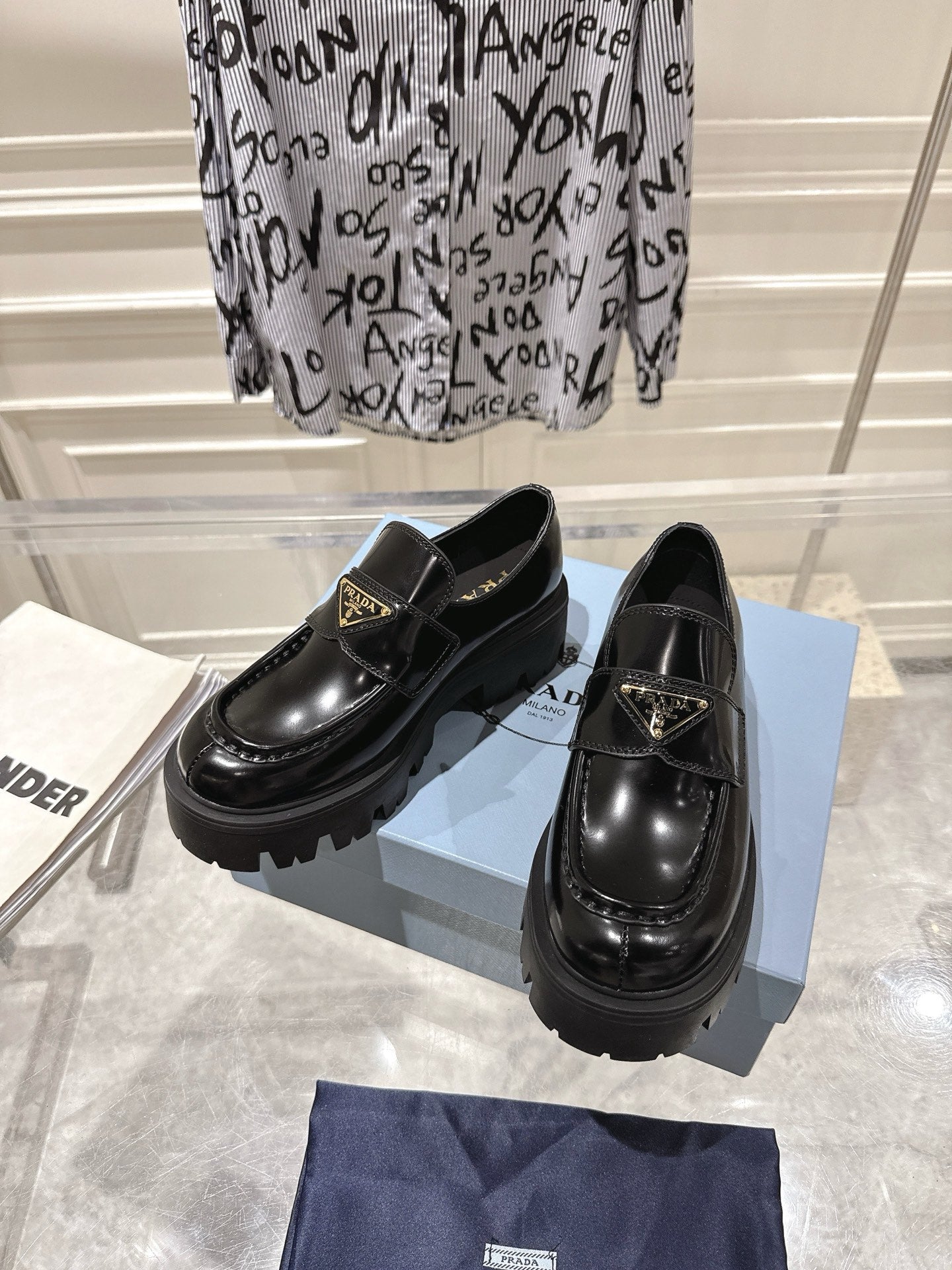 PRADA 26S PLATFORM LOAFERS 45MM IN BLACK SHINE CALFSKIN