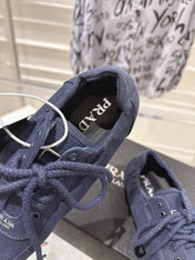PRADA 26S COLLAPSE SNEAKERS IN BLUE CANVAS