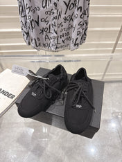 PRADA 26S COLLAPSE SNEAKERS IN BLACK CANVAS