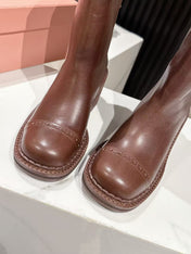 MIUMIU 26S PLATFORM HIGH-HEEL BOOTS 50MM IN BROWN GLOSSY CALFSKIN