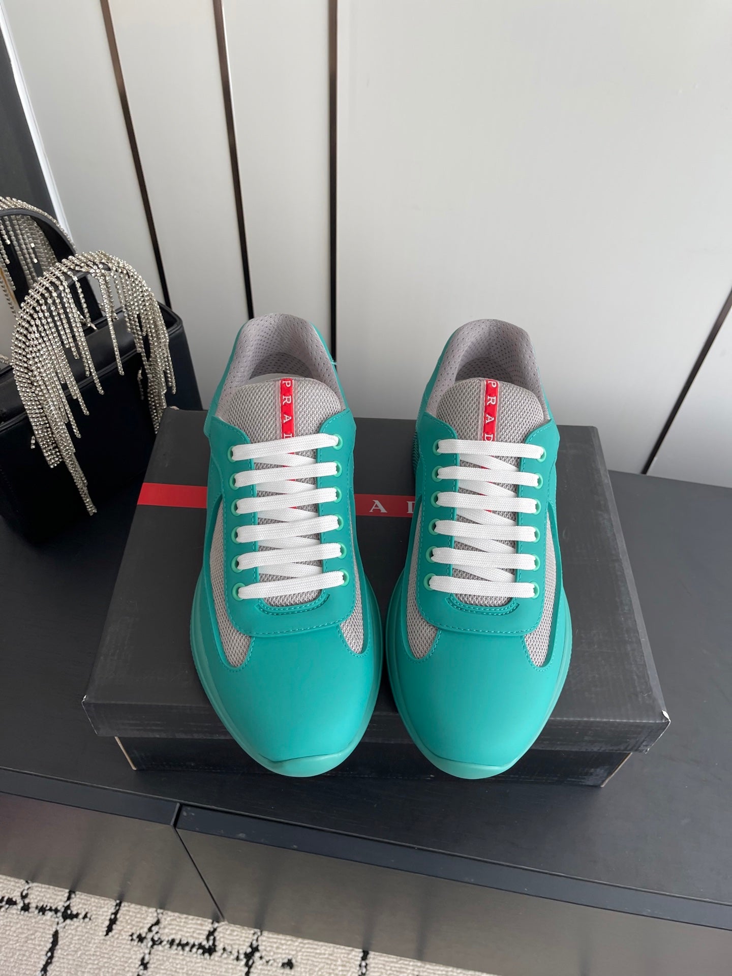 PRADA 26S AMERICA CUP SNEAKERS IN TEAL BLUE SOFT RUBBER AND BIKE FABRIC